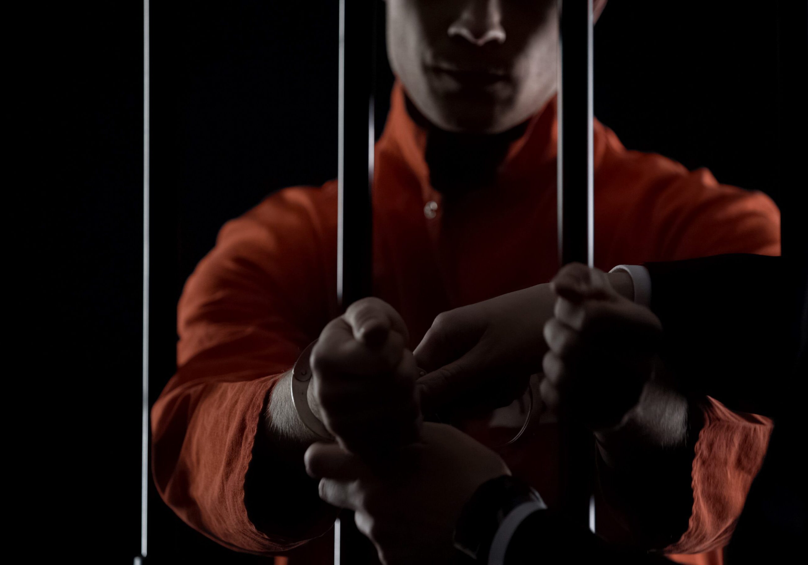 Inmate put on jail handcuffs waiting for trial, crime punishment, law breaking